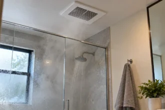Best bathroom exhaust fan removing steam and moisture from a modern bathroom after a hot shower