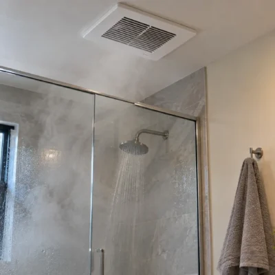 Best bathroom exhaust fan removing steam and moisture from a modern bathroom after a hot shower