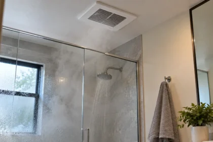 Best bathroom exhaust fan removing steam and moisture from a modern bathroom after a hot shower